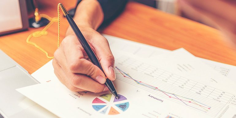pmo Business people using pen,tablet,notebook are planning a marketing plan to improve the quality of their sales in the future.